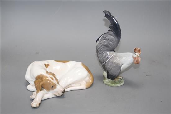 A Royal Copenhagen recumbent dog, model 1634 and a cockerel, model 1025, 20cm and 19.3cm